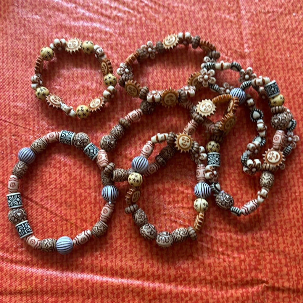 Bracelets Crafted From Wood And Colorful Flowers Bracelets Crafted From Wood And Colorful Flowers